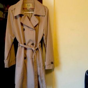 Trench coat next to new